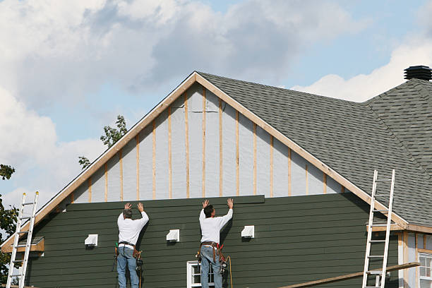 Professional Storm Damage Siding Repair technician working in Conroe, TX